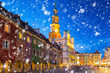 Old town of Poznan on a cold winter night with falling snow, Poland