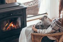Human With Cat Relaxing By The Fire Place