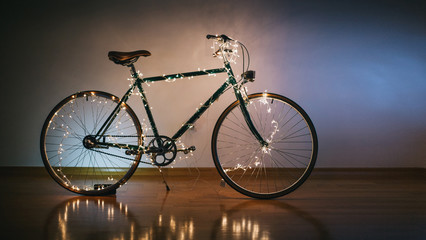 Christmas bicycle. Bike decorated with christmas lights