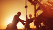 Oil worker is checking the oil pump on the sunset background.