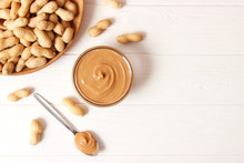  Peanut Butter And Peanut Beans On Wooden Background