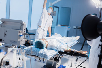 Wall Mural - Professional team of anesthetists at work. The choice of anesthesia is to be agreed upon with a surgeon and an anesthesiologist in advanced surgery.