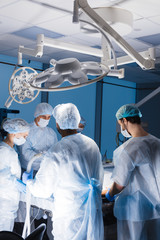 Wall Mural - Professional team of anesthetists at work. The choice of anesthesia is to be agreed upon with a surgeon and an anesthesiologist in advanced surgery.