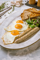 Wall Mural - Fried eggs with tomatoes and toast