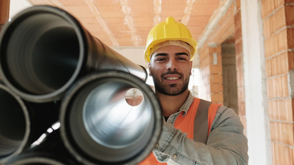 Portrait Of Young Man Working In Construction Site