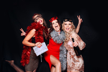 Wall Mural - Beautiful Women Celebrating New Year. Portrait Of Happy Smiling Girls In Stylish Glamorous Dresses With Champagne At Birthday Party.