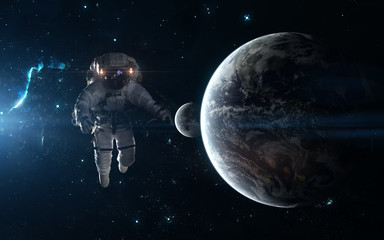 Wall Mural - astronaut, earth and moon on background of star clusters. science fiction art. elements of the image