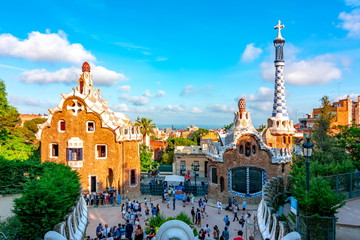 Wall Mural - People walking near Guell park pavilions, Spain