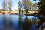 Fototapeta Tęcza - Natural pond in beautiful countryside