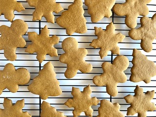 Gingerbread cookie cutouts on a wire cooling rack