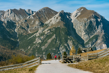 a man and woman hiking in the fanes sennes prags nature park near schluderbach carbonin in the south