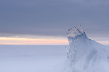 Wall Mural - a snowstorm on the surface of the frozen sea, the wind carries snowflakes through the ice floe.