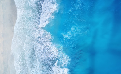 Wall Mural - beach and waves from top view. turquoise water background from top view. summer seascape from air. t
