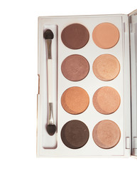 Makeup brush and nude eye shadows palette