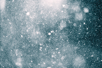 Wall Mural - snowfall shining in the dark. texture background