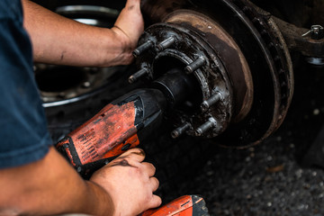 Mechanic Working on Wheel Hub Assembly 