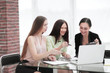 © yurolaitsalbert - close up.three employees of the company work with documents at the table in the office