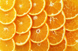 Food background - slices of ripe orange fruits