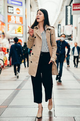 Wall Mural - woman in smart casual suit walking joyful