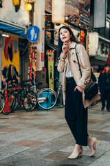 Wall Mural - lady traveler thinking the right way to hotel.