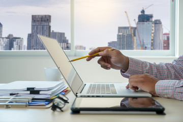 Poster - double exposure of business man hand working on laptop computer on wooden desk with social media network diagram