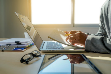 Poster - double exposure of business man hand working on laptop computer on wooden desk with social media network diagram