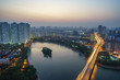 Aerial skyline view of Hanoi city, Vietnam. Hanoi cityscape by sunset period at Linh Dam lake, Hoang Mai district