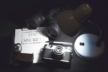 Wall Mural - top secret information data on the secret service agent table background. espionage concept.