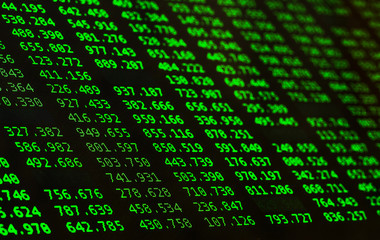 Financial data of green color on a monitor. Finance data concept. Macro