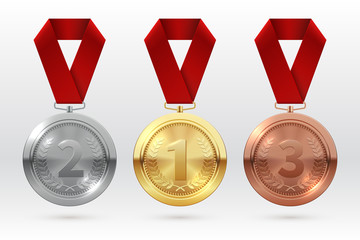 sports medals. golden silver bronze medal with red ribbon. champion winner awards of honor vector is