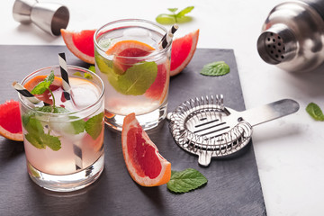 Wall Mural - Cocktail or refreshing drink with grapefruit and mint close-up