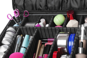 Stylish case with makeup products and beauty accessories, closeup