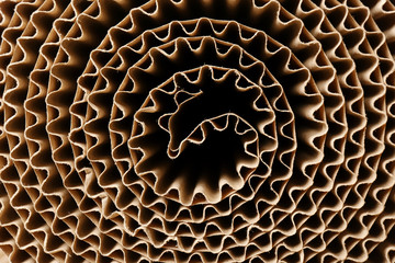 Roll of brown corrugated cardboard, closeup. Recyclable material