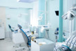 Blurred view of dentist office with chairs and professional equipment