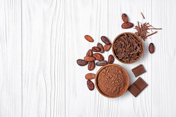 Wall Mural - chocolate with cocoa beans and bowl of chocolate chips and cacao powder for confectionery