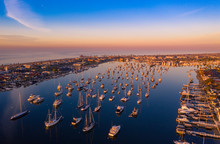 Drone Shot Of Newport Beach Harbor In Orange County, California Early In The Morning With Boats Below.