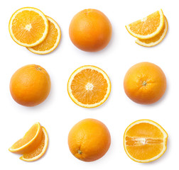 Wall Mural - A set of whole and sliced oranges, cut out. Top view.