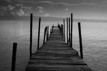 Black White Monochrome Old Wooden Bridge Cross Path To Sea. Concept Of Alone Sadness Walk To Nowhere Without Destination And No One Help Guide The Way