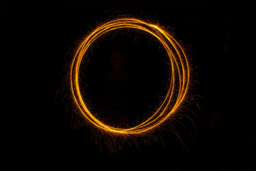 Abstract sparkler firework light on black background