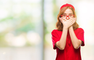 Wall Mural - Young beautiful woman over isolated background shocked covering mouth with hands for mistake. Secret concept.