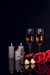 Wall Mural - Glasses of champagne, roses, candles and heart shape chocolates