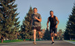 © realstock1 - The old and young sportsmen running on the road