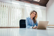 © bnenin - Portrait of a beautiful businesswoman working on laptop. Copy space.