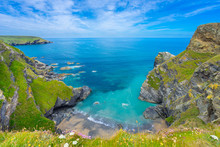 View Of The South Devon Coast, England, In The Summer With Clear Waters, Blue Sky And Grass.