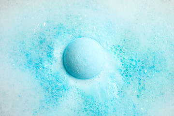 Wall Mural - Color bath bomb dissolving in water, top view