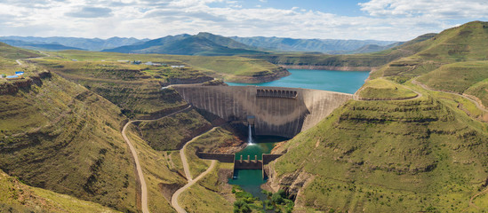 High resolution panorama of dam wall and surrounding landscape at Katse Dam in Lesotho during summer with a low water level on a clear sunny day