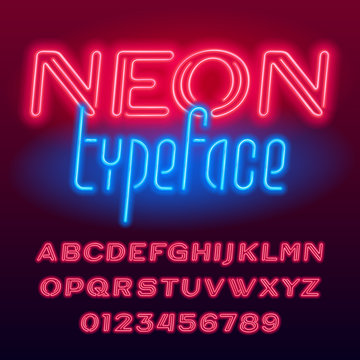 Neon tube alphabet font. Neon color oblique capital letters and numbers. Stock vector typescript for your design.