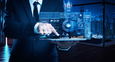 businessman working on digital table with intelligence and analytics of business showing on virtual 
