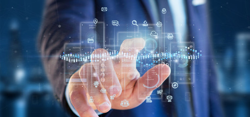 Businessman holding User interface screens with icon, stats and data 3d rendering