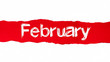 The word February appearing behind red torn paper